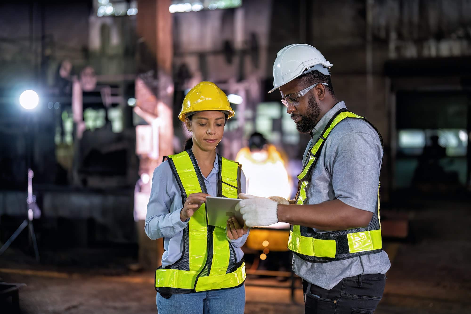 Property maintenance and construction workers use mobile device