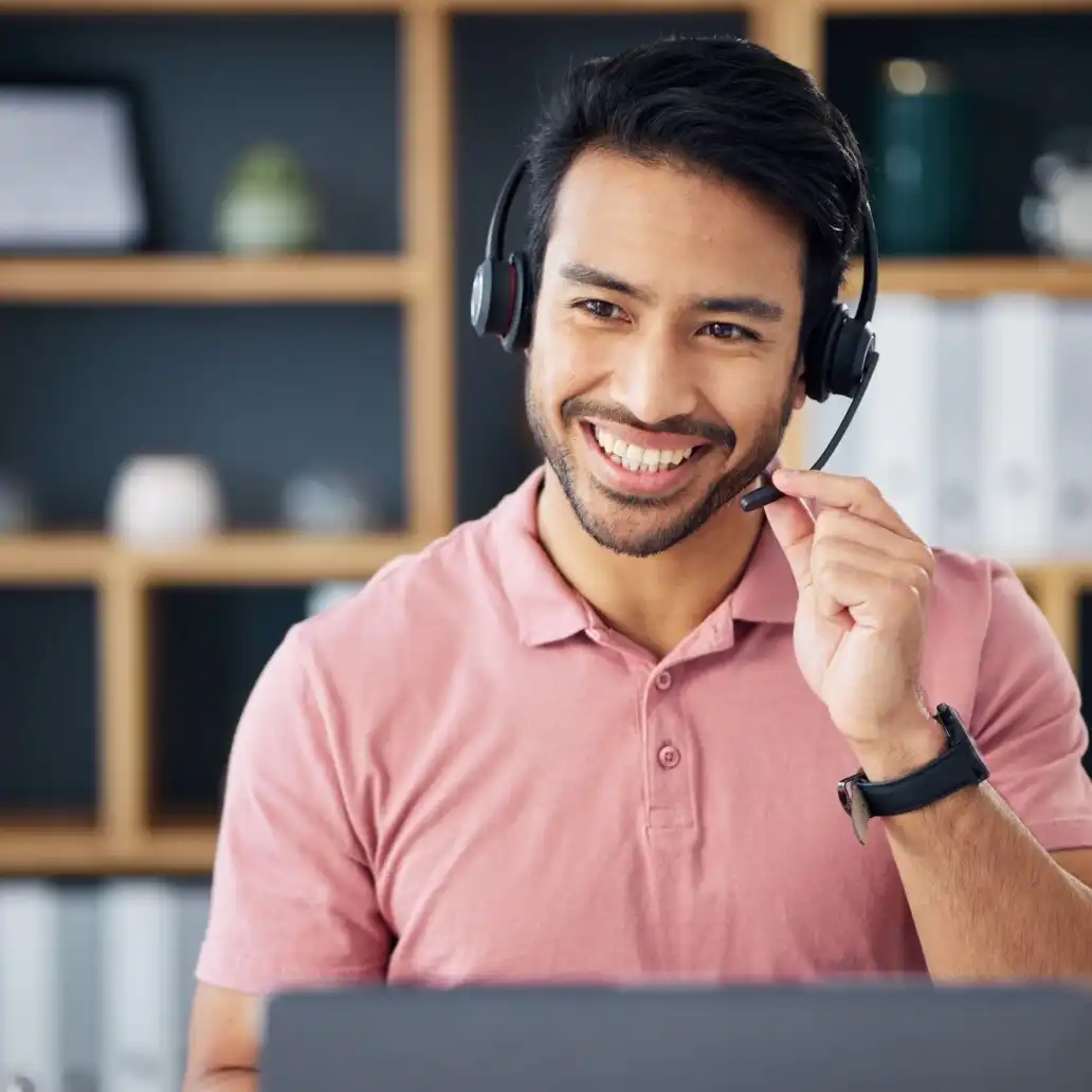 asian-man-call-center-and-headset-on-laptop-with-smile-for-consulting-customer-service-or-support-uai-1032x1032