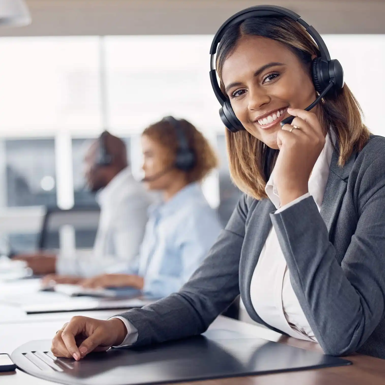 call-center-woman-portrait-and-smile-in-office-for-customer-support-job-happiness-or-microphone-i-uai-1515x1515